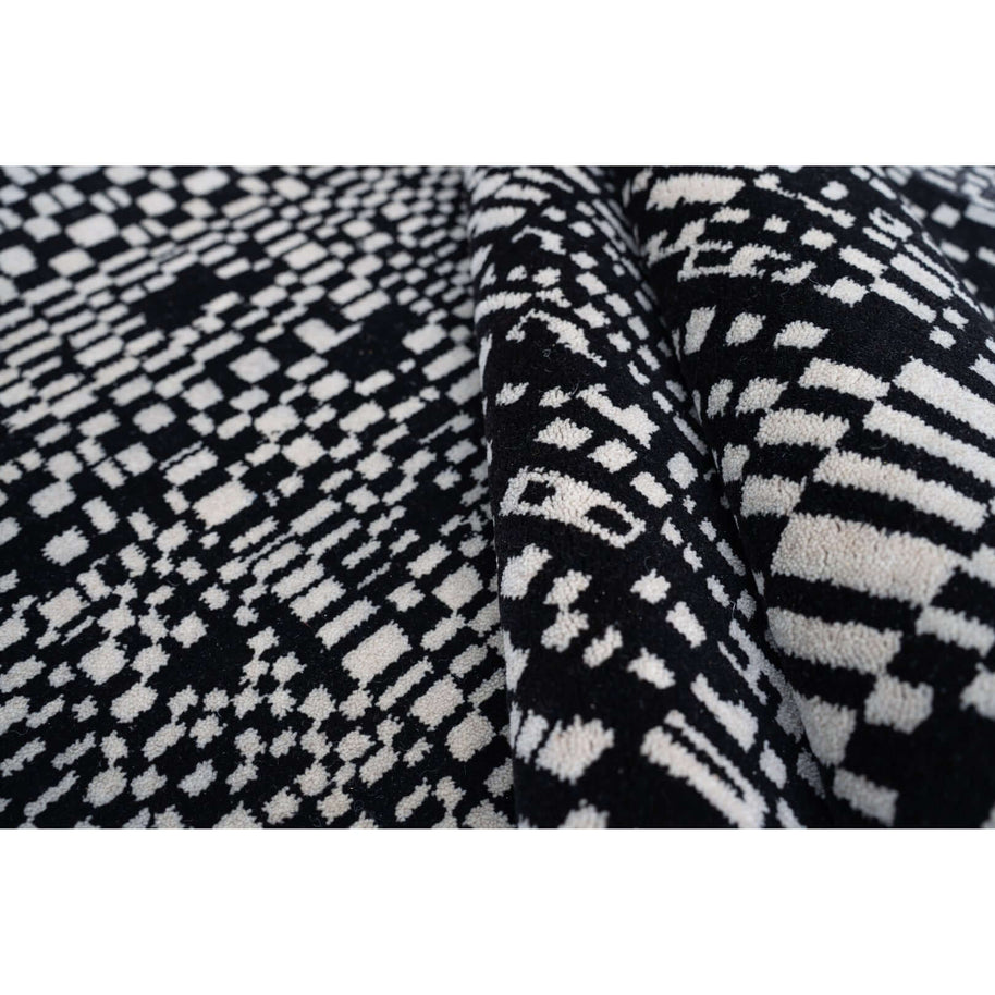 E U G E N E luxury handmade rug by Cherom in black and white New Zealand wool.
