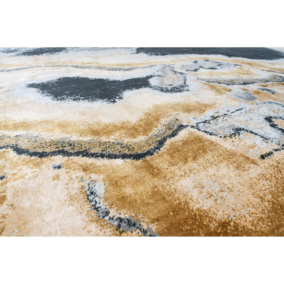 M O N T S E R R A T luxury handmade rug by Cherom in grey and gold hues.