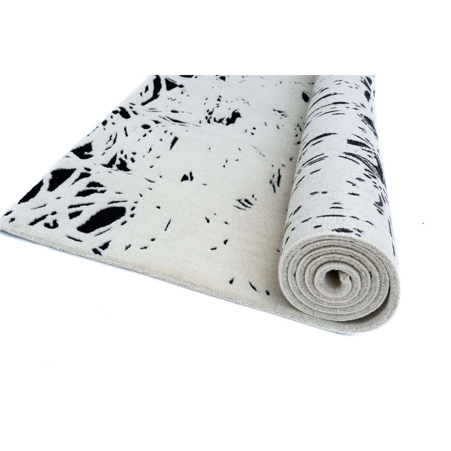 L E N O luxury handmade rug by Cherom, modern black and white New Zealand wool rug, contemporary design.