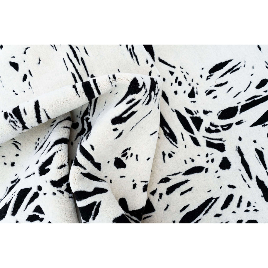 L E N O luxury handmade rug by Cherom in black and white New Zealand wool, modern contemporary design.