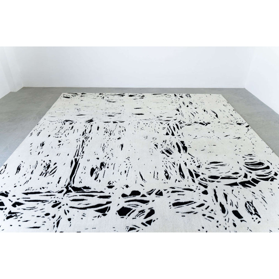 L E N O luxury handmade rug by Cherom, contemporary design in black and white, made from New Zealand wool.
