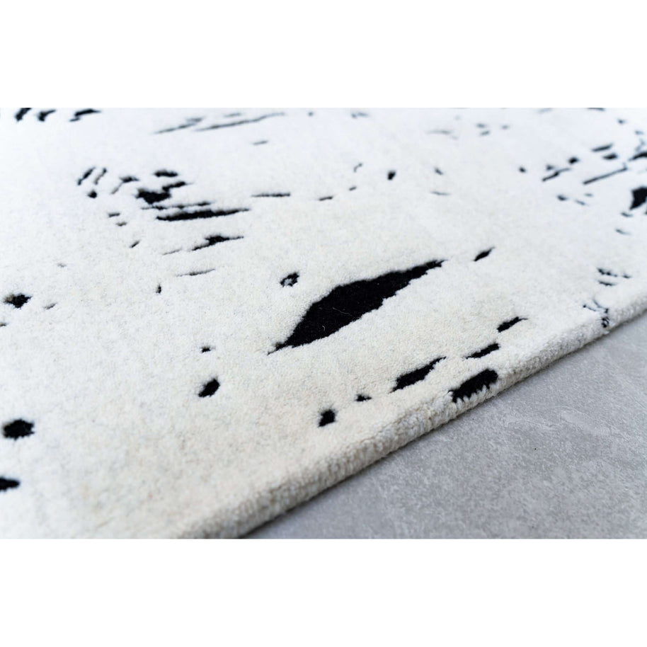 L E N O luxury handmade rug by Cherom, black and white New Zealand wool modern rug with doodle pattern.