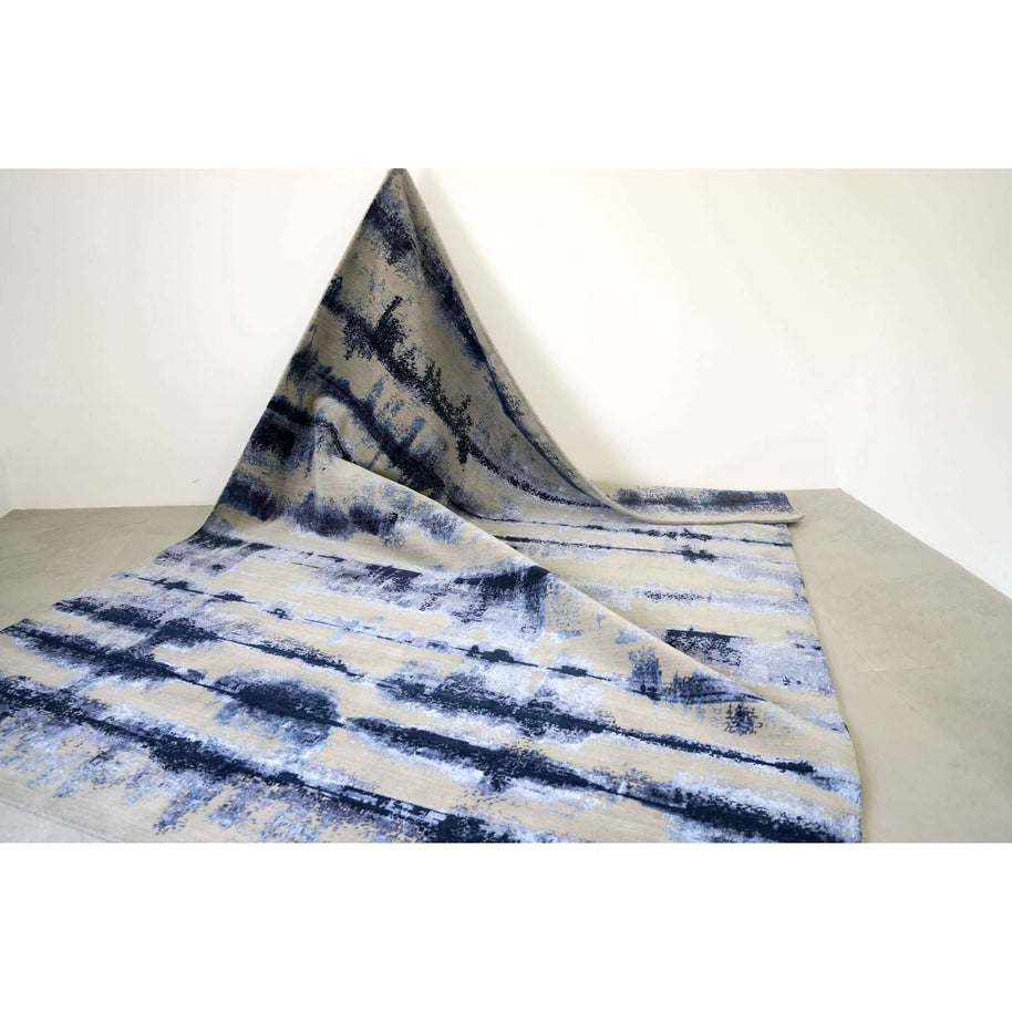 A M B R E T T E luxury handmade rug by Cherom in blue gradient, made of New Zealand wool.