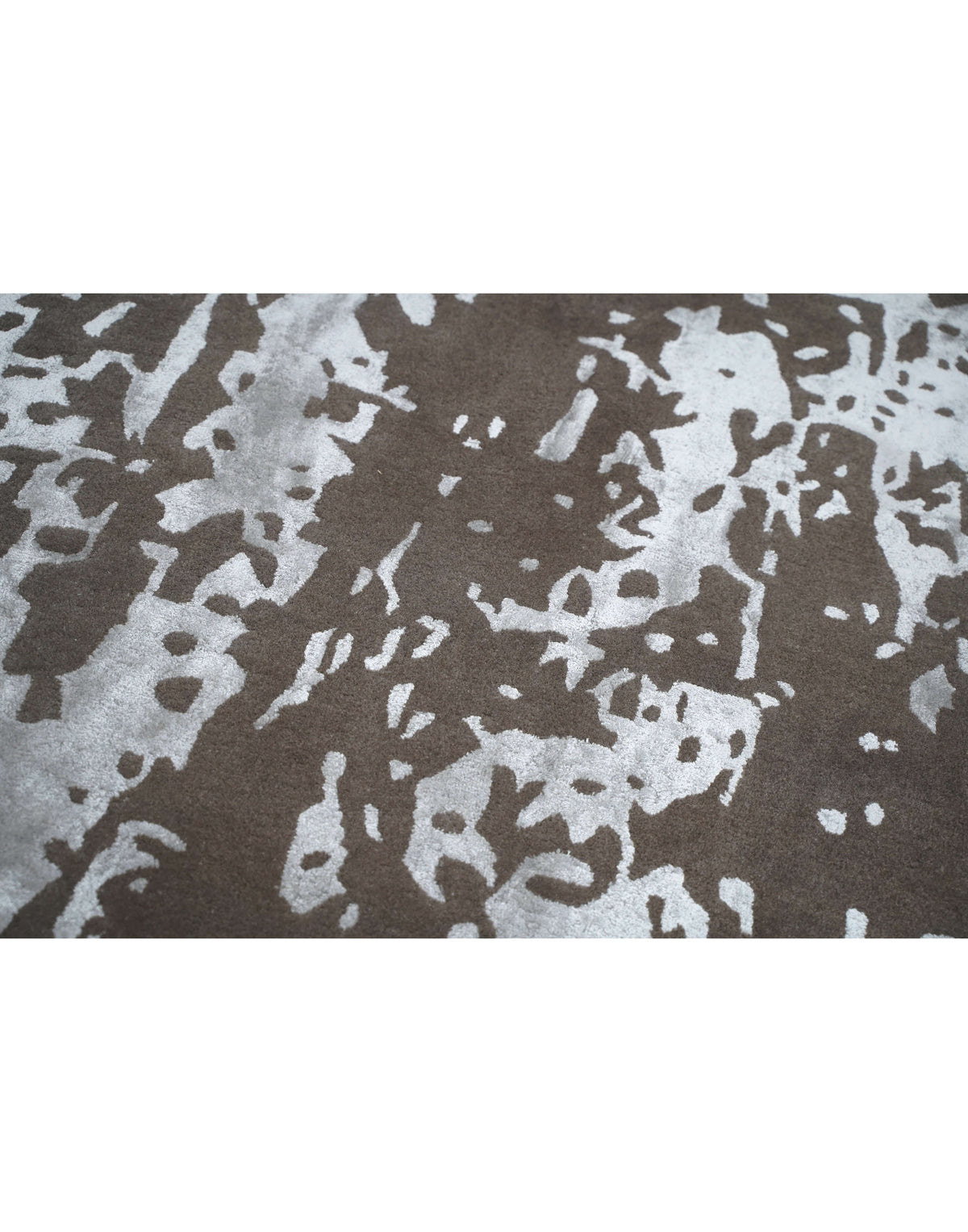 I R V I N G luxury handmade rug by Cherom in brown and silver New Zealand wool with modern abstract design.