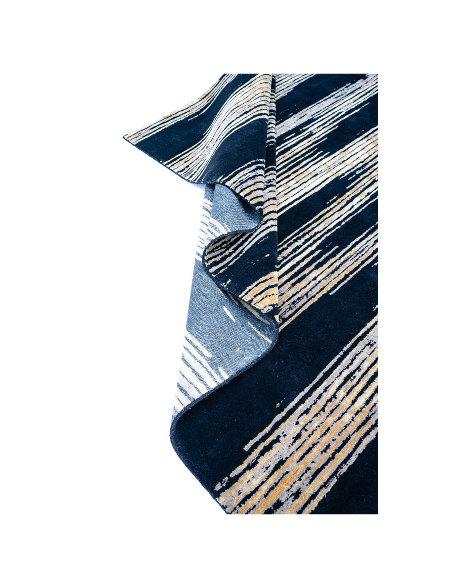 C A R L Y L E luxury handmade rug by Cherom in black and gold New Zealand wool with contemporary design.