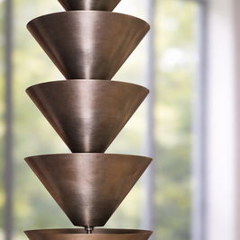 Bronze pendant light fixture with a modern interior background