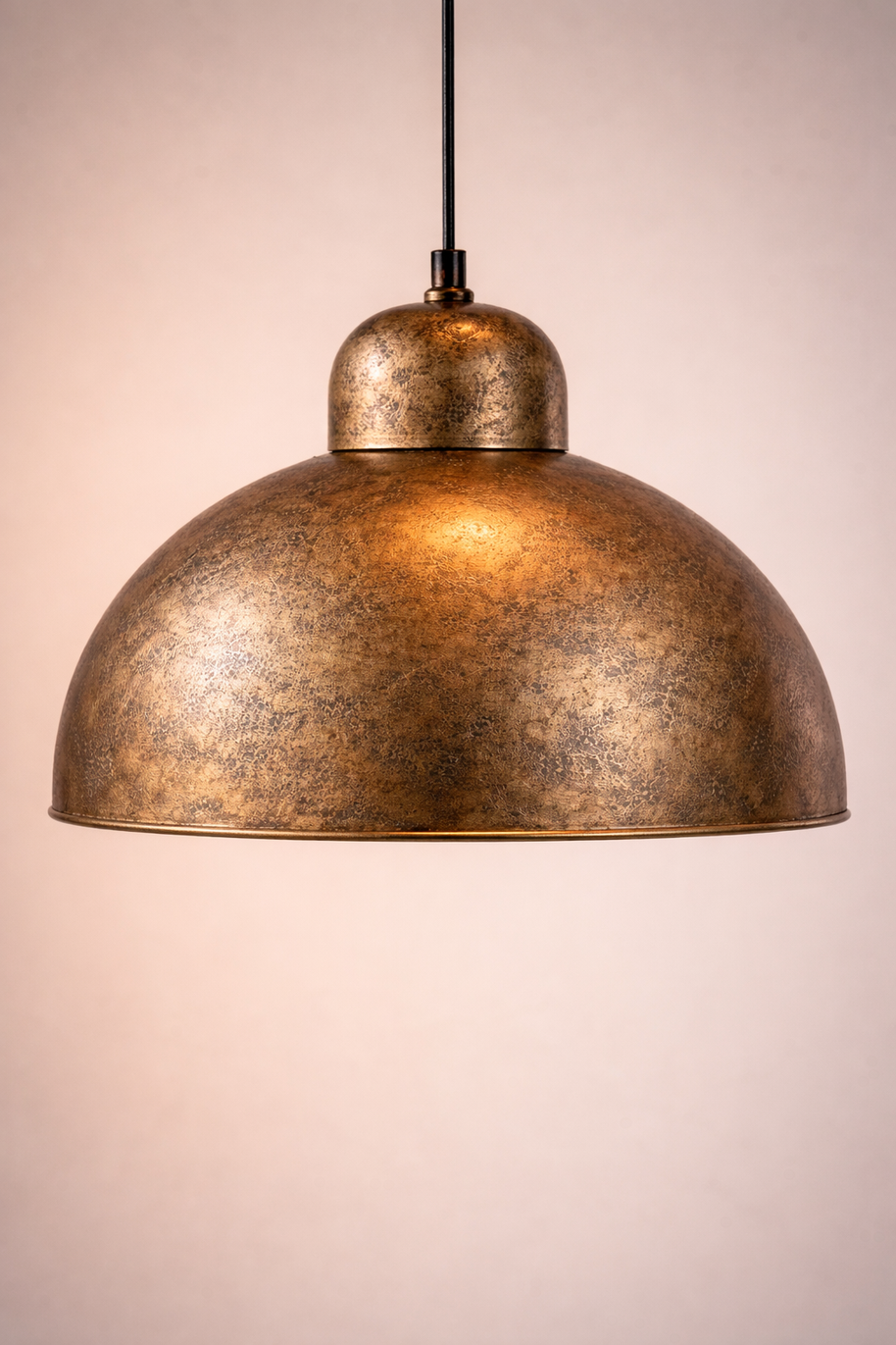 Bronze pendant light on a plain background