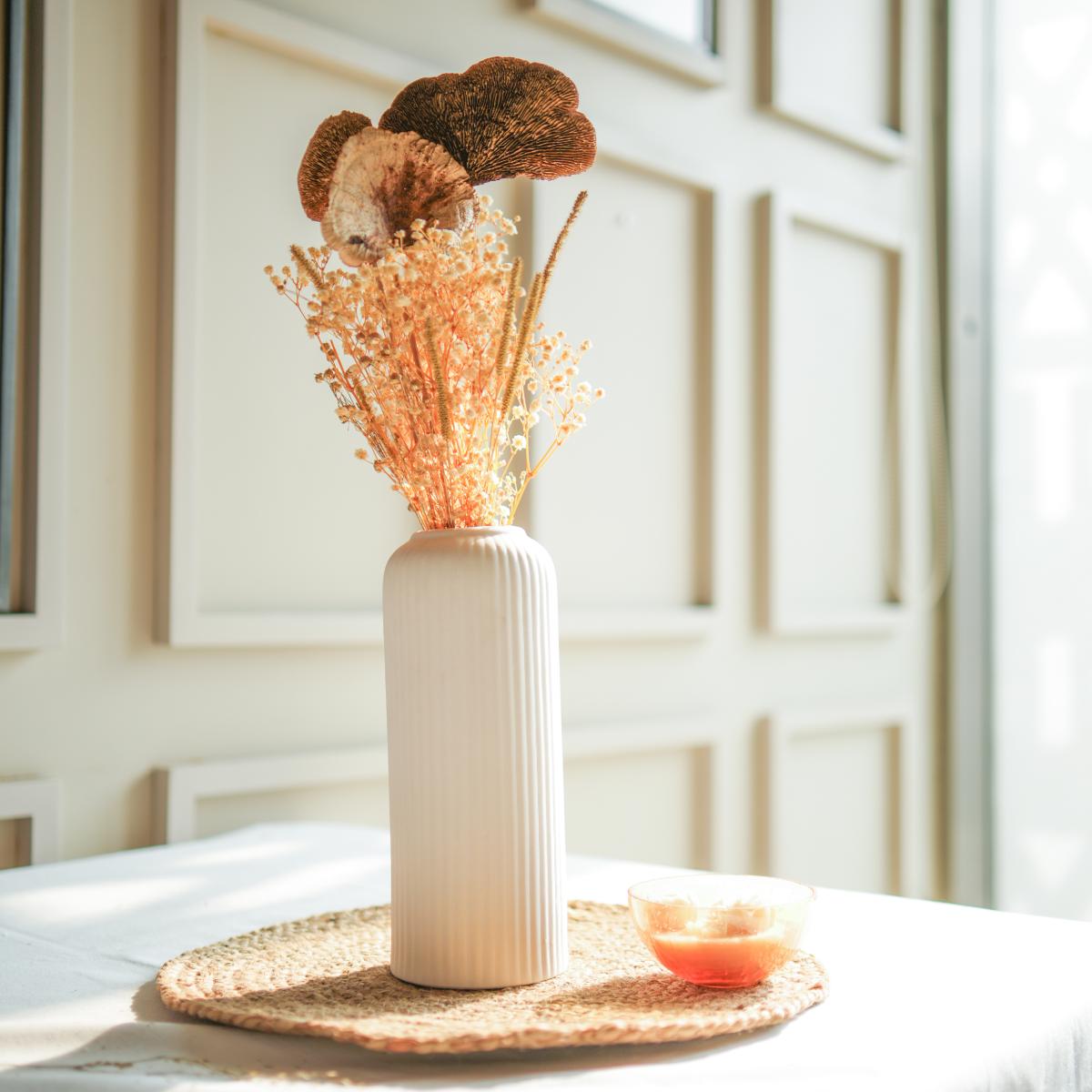 Golden harvest bunch with snow white vase