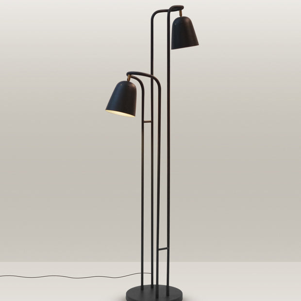 Contemporary floor lamp with a minimalist design and dual adjustable heads for versatile lighting.