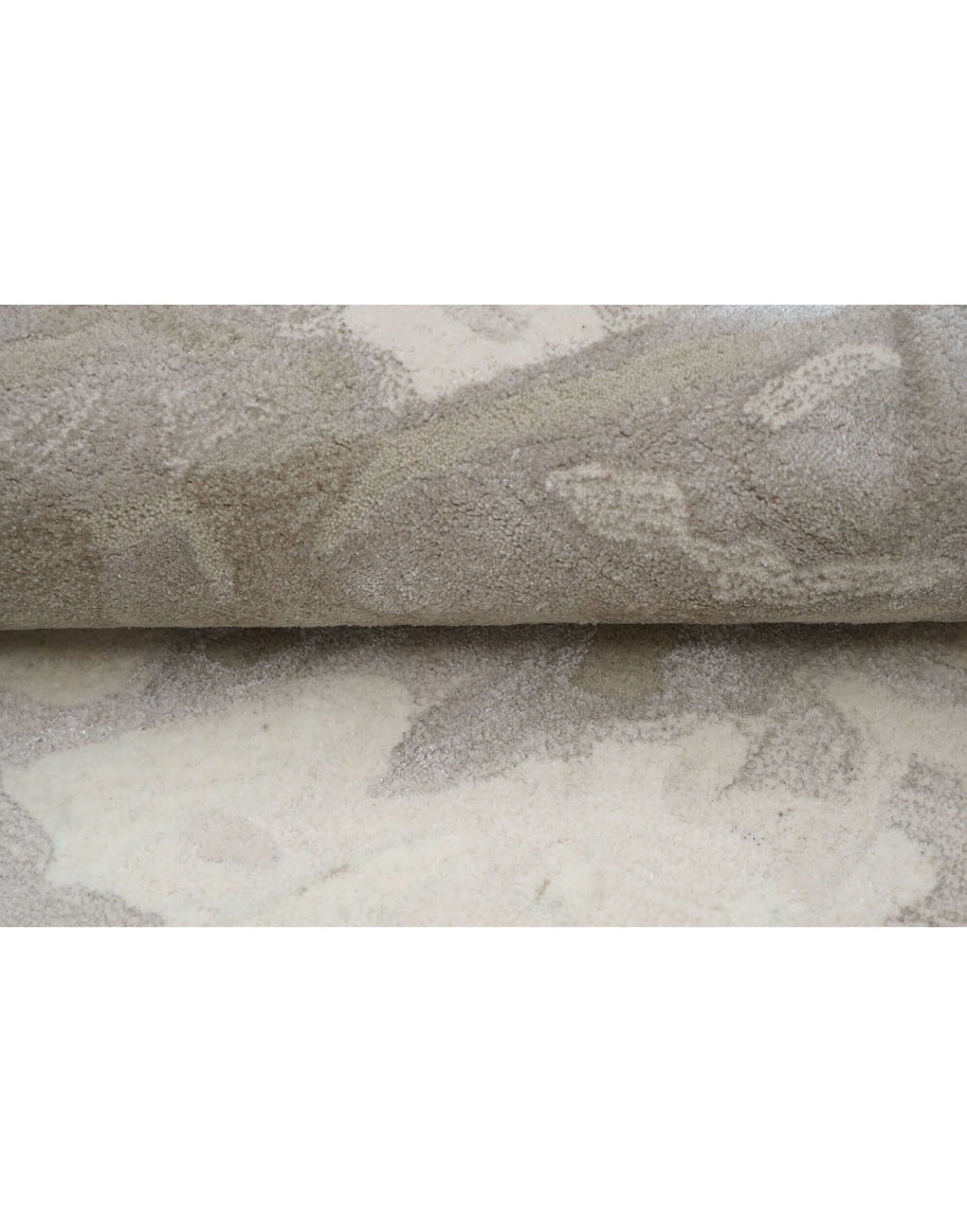 E L S A luxury handmade rug by Cherom in beige and taupe, made from New Zealand wool, showcasing contemporary design.