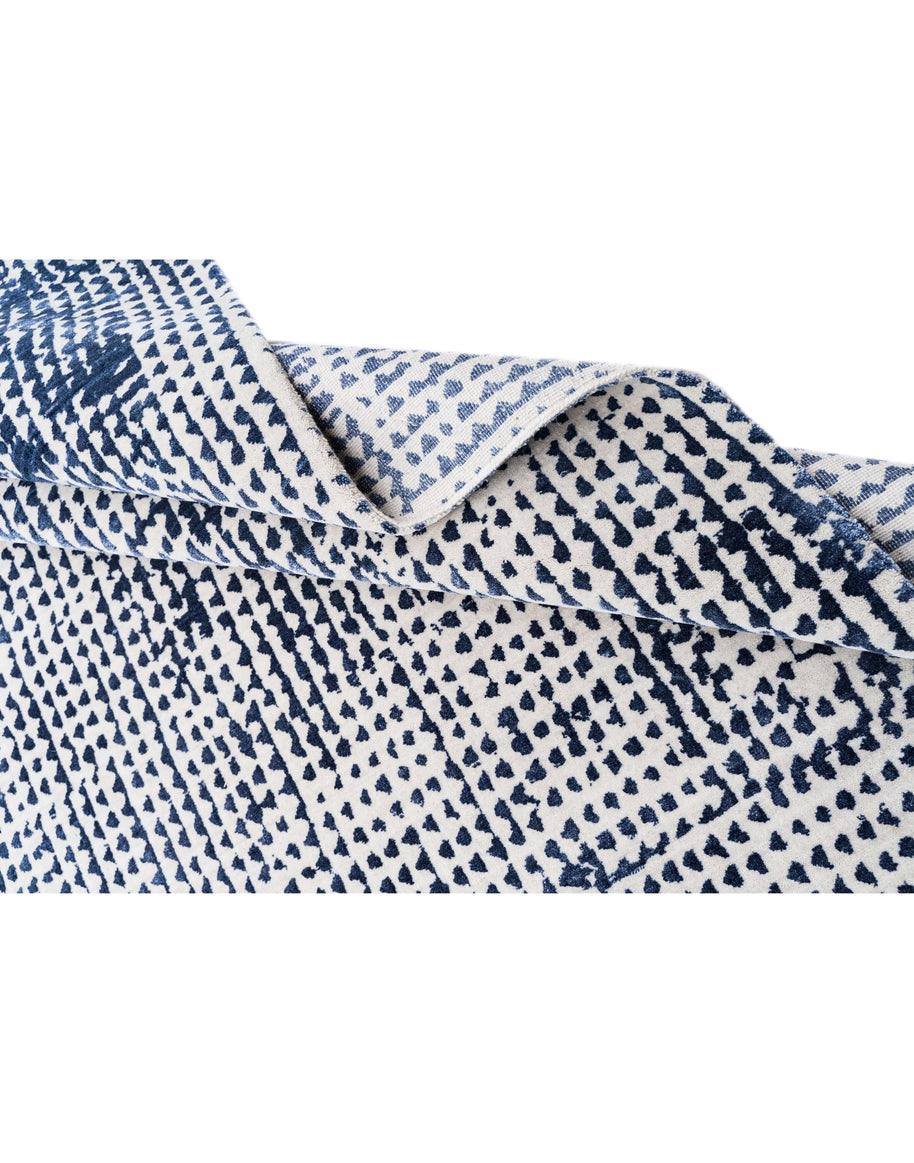 O D M É luxury handmade rug by Cherom in navy wool and bamboo silk.