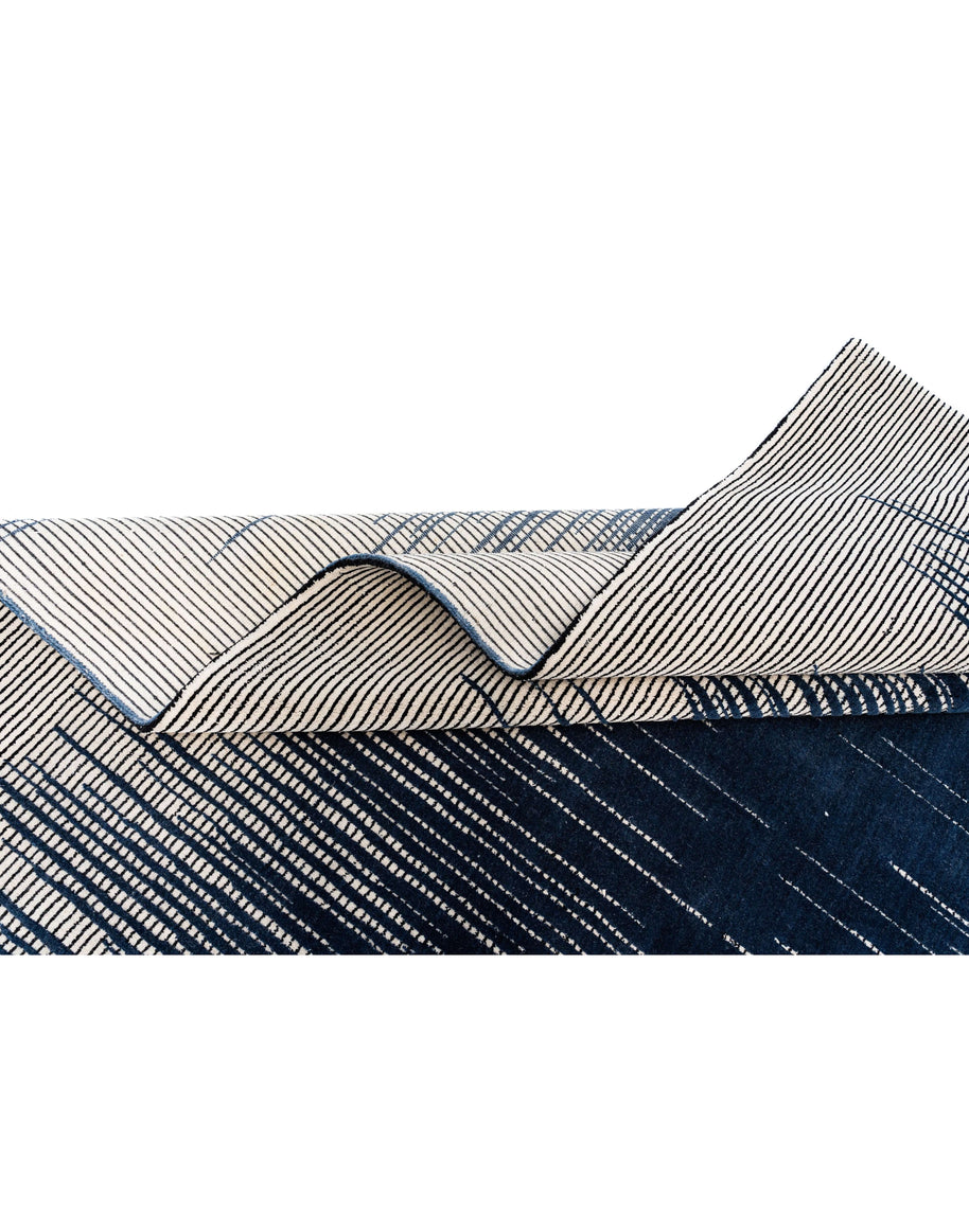 H A R V E Y luxury handmade rug by Cherom in navy New Zealand wool with modern stripes.