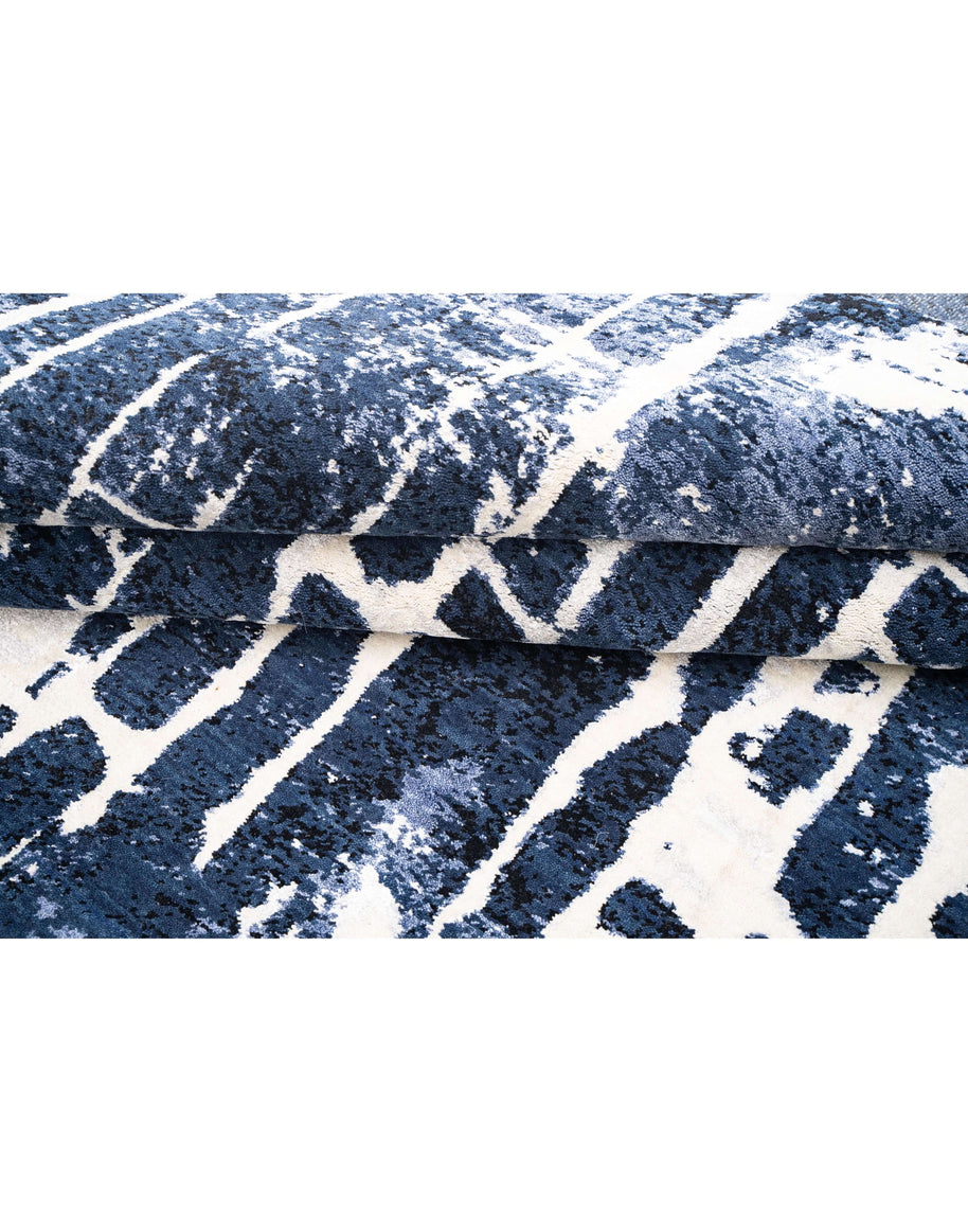 M A R C O N I luxury handmade rug by Cherom in navy New Zealand wool, contemporary design with textured patterns.