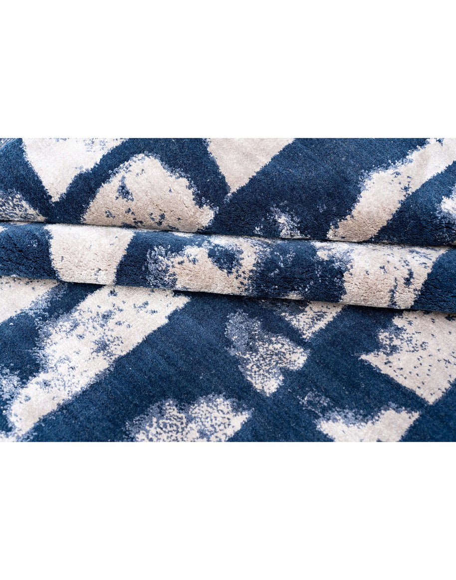 C A N A L I luxury handmade rug by Cherom in blue and beige New Zealand wool with modern geometric design.