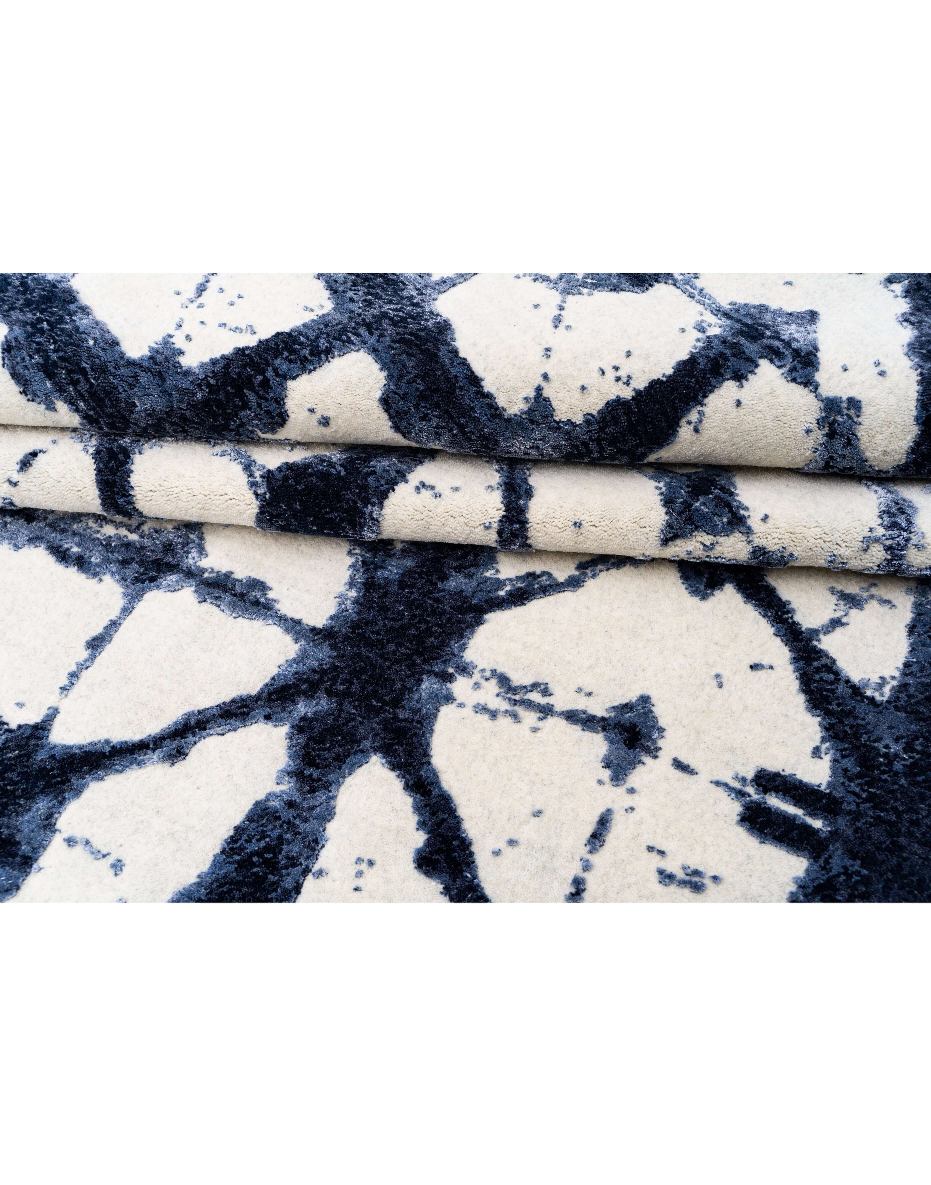 S H I B O R I luxury handmade rug by Cherom in blue New Zealand wool, contemporary design.