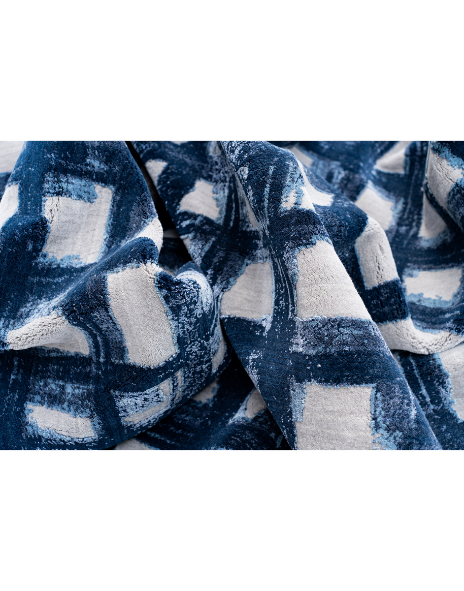 E V I A N luxury handmade rug by Cherom in navy and white wool.