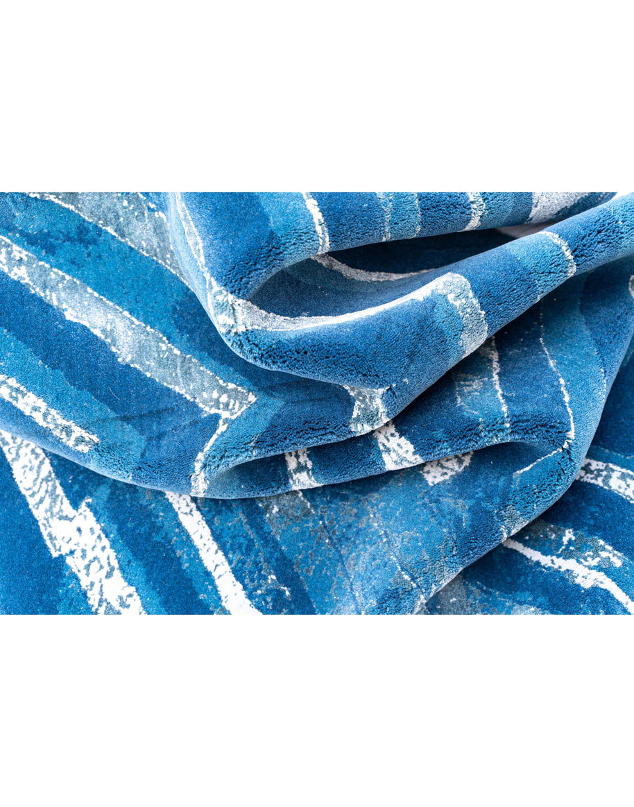 F U R L A luxury handmade rug by Cherom in blue New Zealand wool, contemporary design features bold stripes.