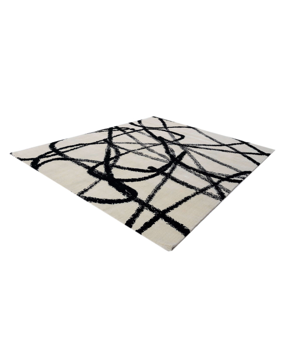 S A C A I luxury handmade rug by Cherom, modern black and white design, New Zealand wool.