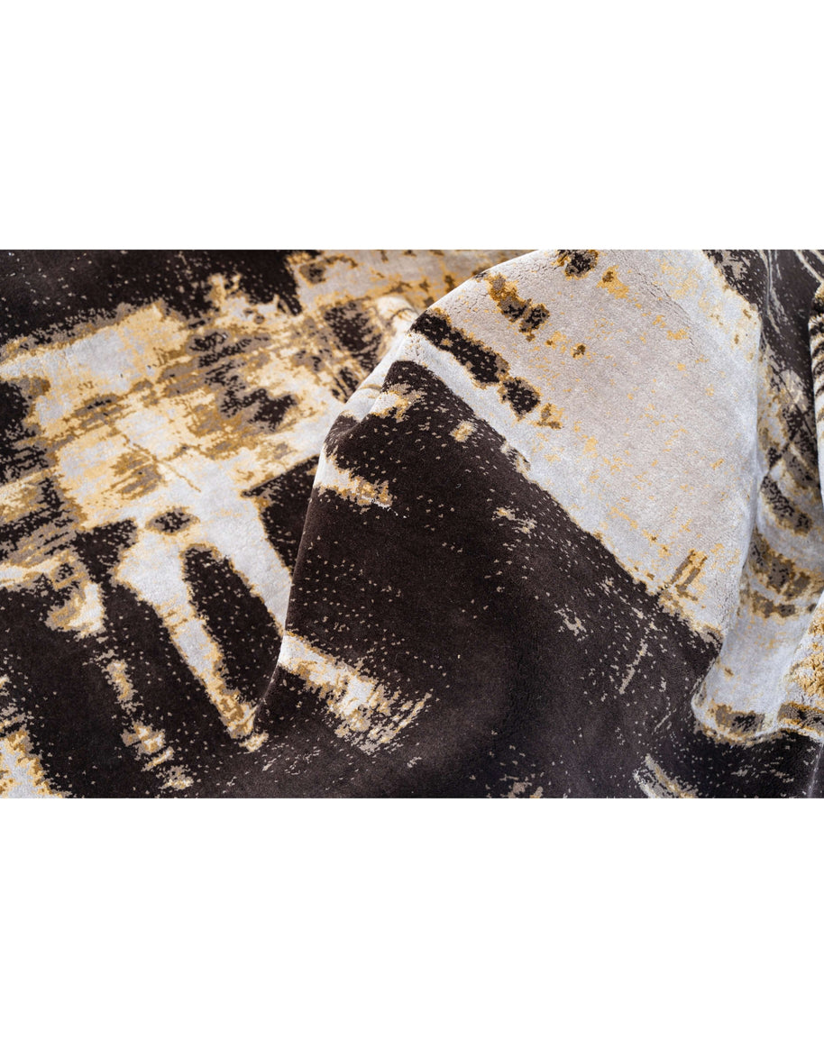 L Y M A N luxury handmade rug by Cherom, featuring New Zealand wool in modern black, cream, and gold tones.