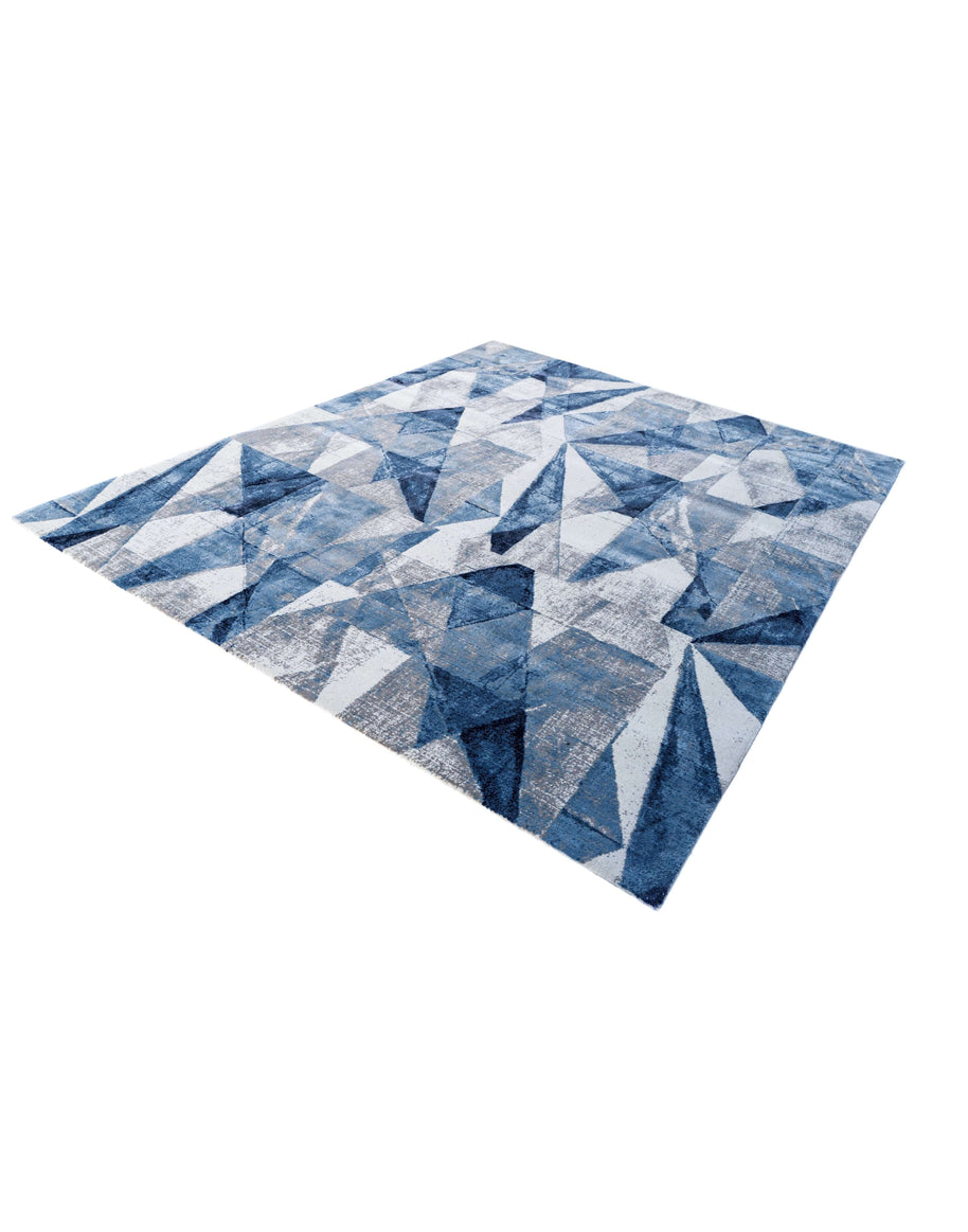 G E R A R D luxury handmade rug by Cherom in blue New Zealand wool, modern geometric design.