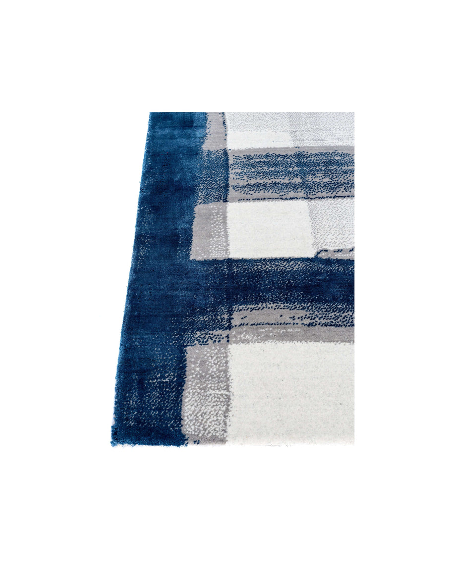 A S T O R I A luxury handmade rug by Cherom, featuring New Zealand wool in navy and white, contemporary design