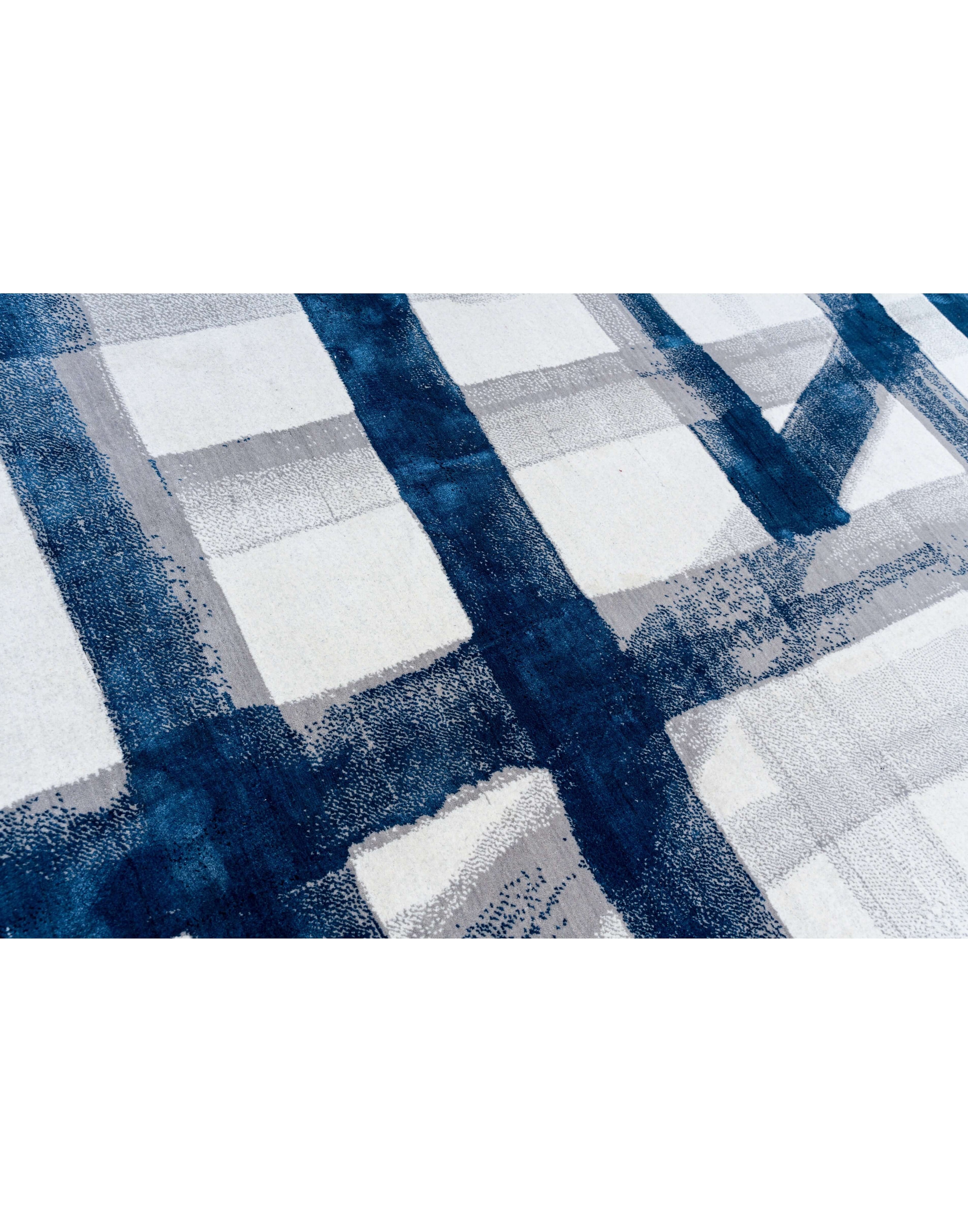 A S T O R I A luxury handmade rug by Cherom in navy and white New Zealand wool with contemporary design.