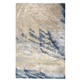 E V O K E luxury handmade rug by Cherom in New Zealand wool, showcasing abstract soft greys and muted blues.