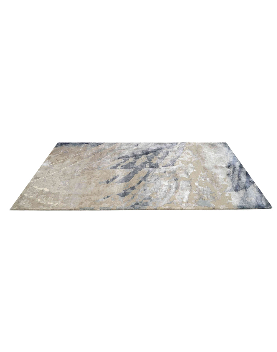 E V O K E luxury handmade rug by Cherom in soft greys and muted blues, made from New Zealand wool.