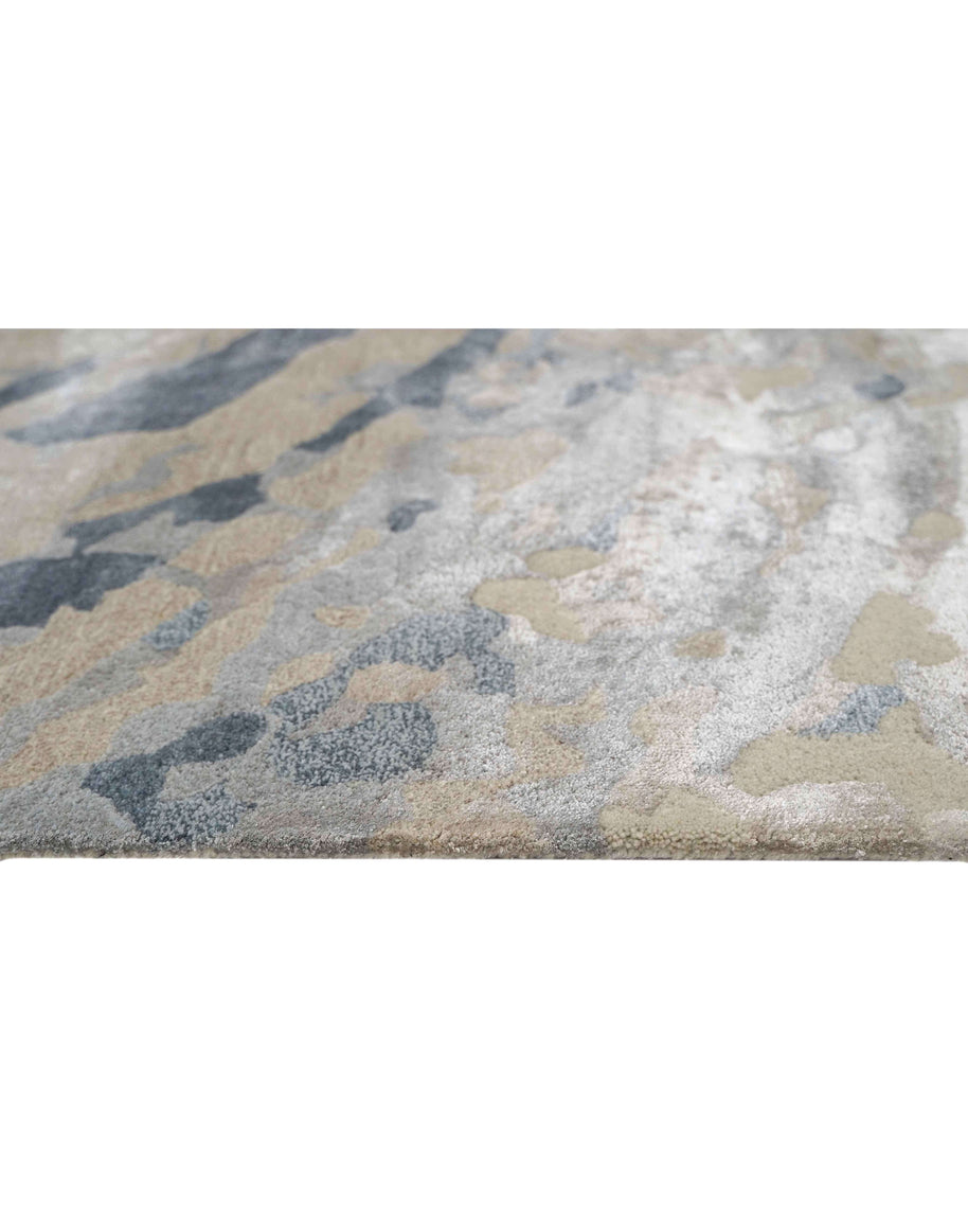 E V O K E luxury handmade rug by Cherom in soft greys, muted blues, New Zealand wool.