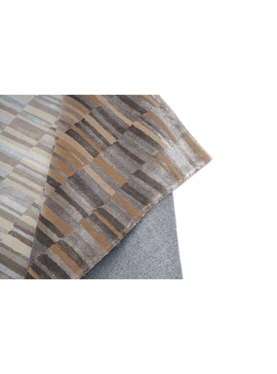 B A S K luxury handmade rug by Cherom in New Zealand wool, rich brown and beige tones.