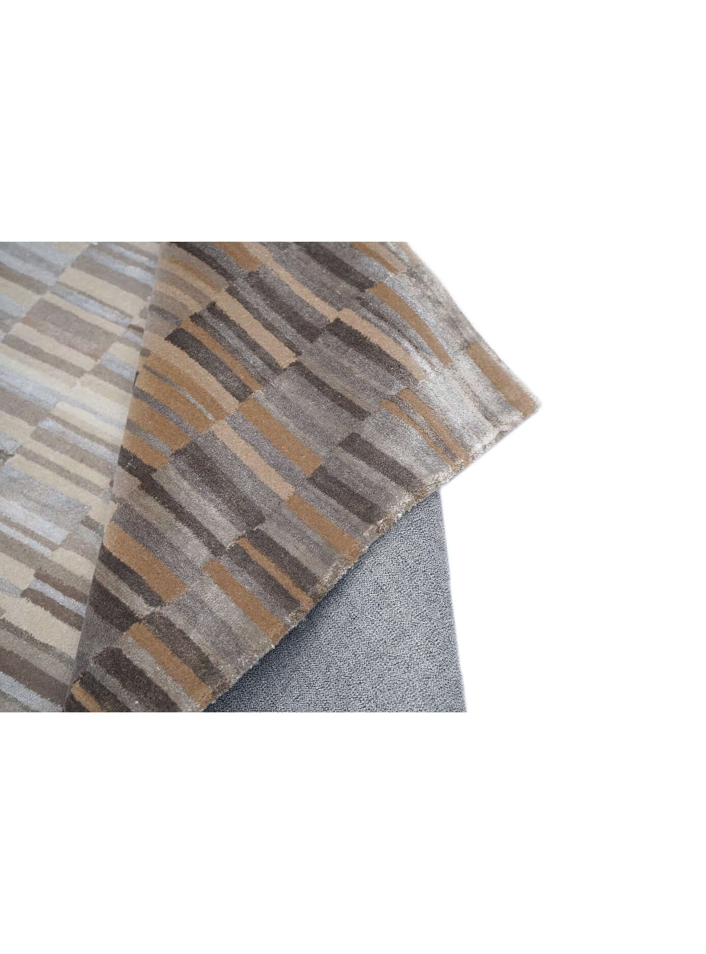 B A S K luxury handmade rug by Cherom in New Zealand wool, rich brown and beige tones.