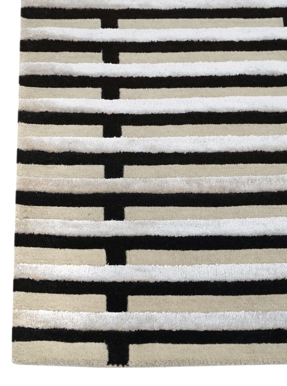 S T R I A L luxury handmade rug by Cherom, modern design in black and cream, New Zealand wool.