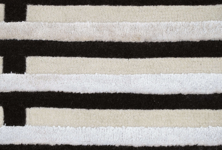 S T R I A L luxury handmade rug by Cherom, black and cream New Zealand wool, modern design.