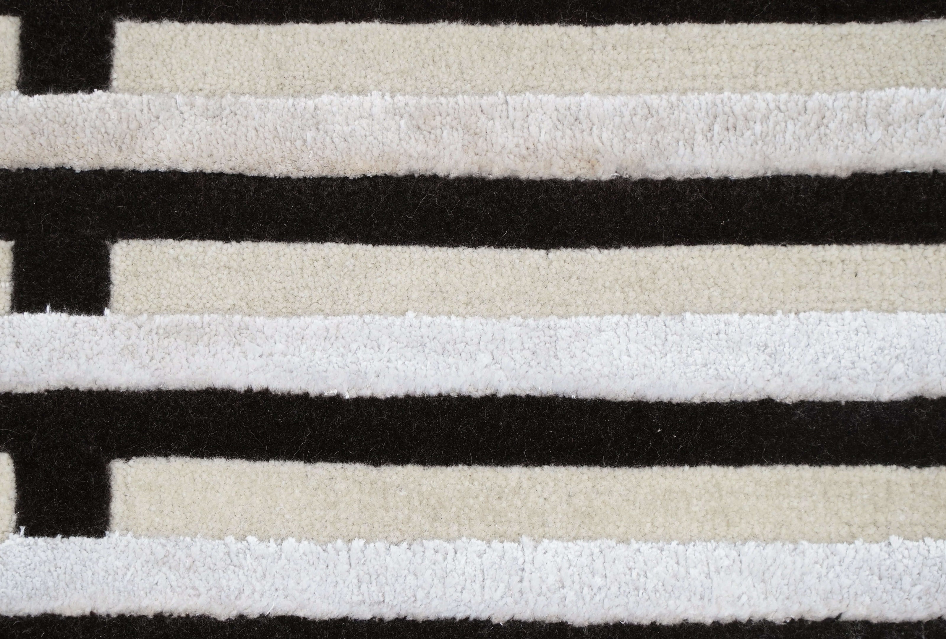 S T R I A L luxury handmade rug by Cherom, black and cream New Zealand wool, modern design.
