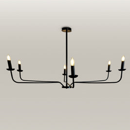 Elegant black metal chandelier with candle flame light bulbs, providing a warm glow in an entryway