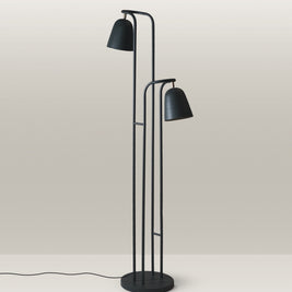 Floor lamp with a sleek design, dual-head configuration, and matte green finish.
