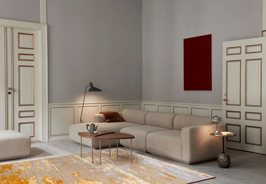 A S T O N - G O L D luxury handmade rug by Cherom in a contemporary living room with neutral tones.