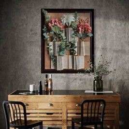 Decorative floral frame with rolled book paper, eucalyptus stems, and pink and white fabric flowers
