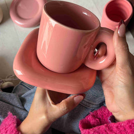 Chunky pink monotone mug and saucer. ceramic saucer is square shape.