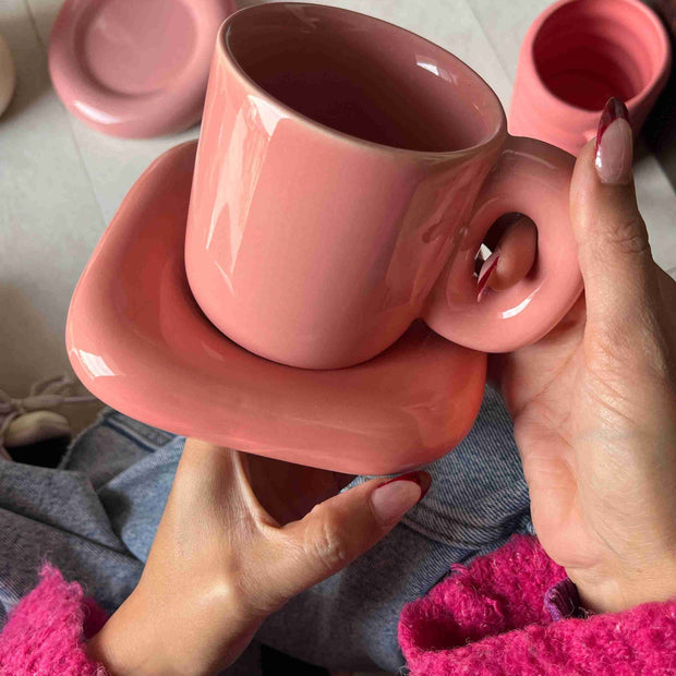 Chunky pink monotone mug and saucer. ceramic saucer is square shape.