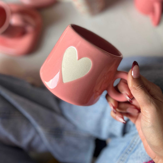 Cute pink mug with white matte heart in the centre