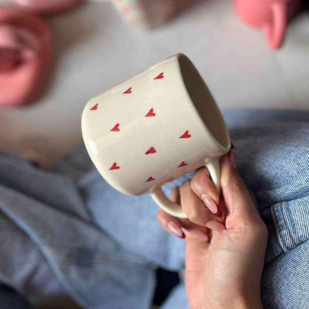 Ceramic mug with small red hearts, coffee, tea, drinking