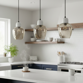 Modern kitchen with pendant lights, white countertops, and wooden stools.