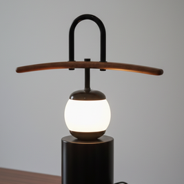 Modern table lamp with wooden arm on a wooden surface