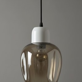 Smoked glass pendant light with white base on a gray background