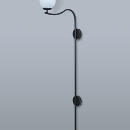 Sophisticated black metal wall lamp with a spherical white lampshade, perfect for creating a cozy ambiance