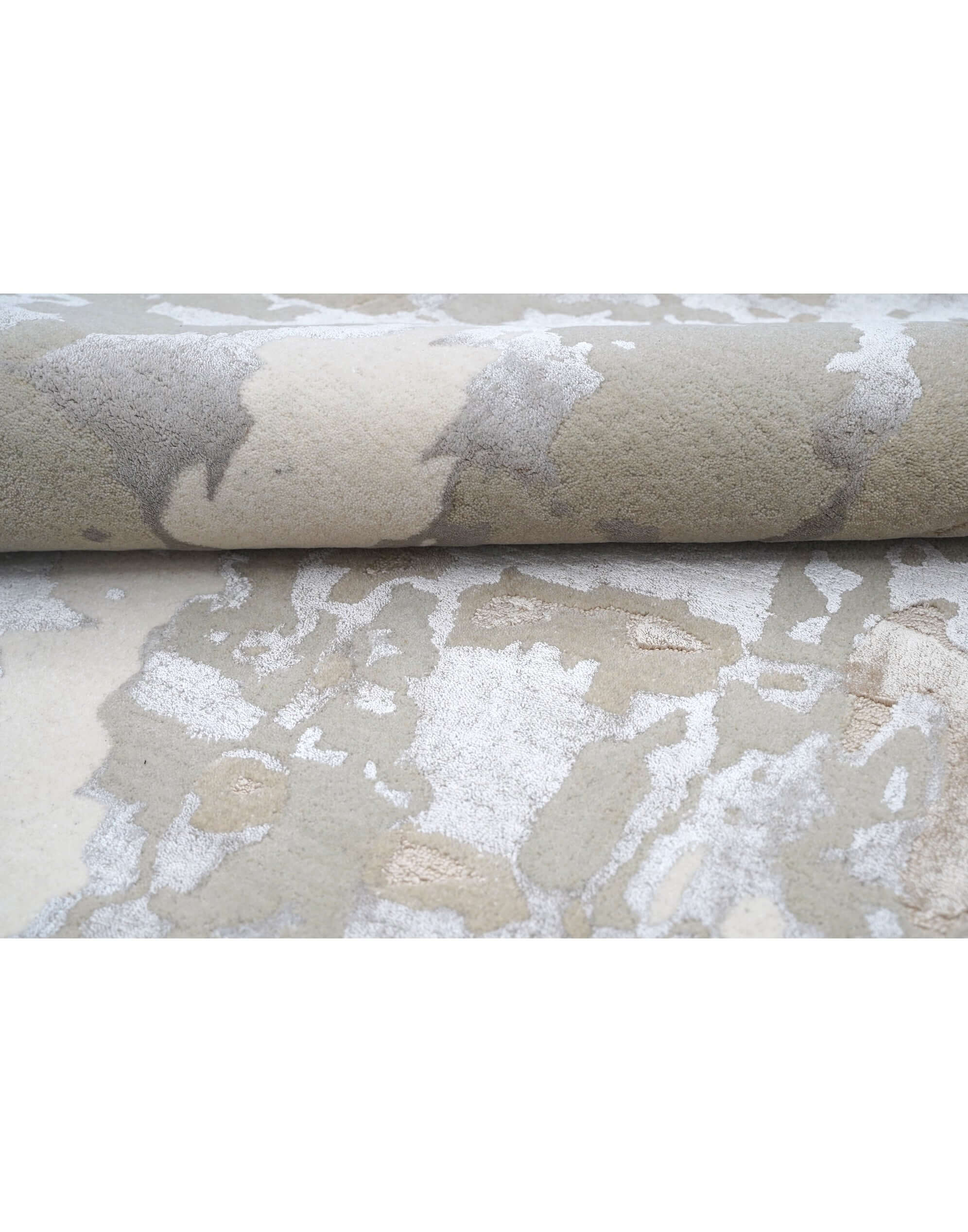 T A O S luxury handmade rug by Cherom in soft beige and muted grey New Zealand wool.