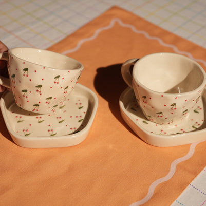 Ceramic cup and saucer with 3D cherry embellishments