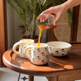 Berry Berry mug and bowl set used for serving coffee, tea, and snacks.