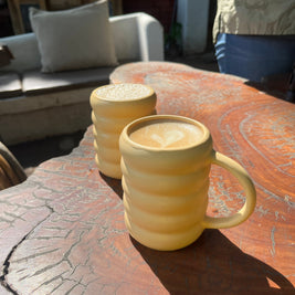Minimal yellow ceramic mug with smooth matte finish